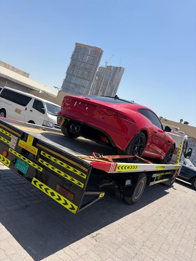 Red Jaguar transport truck